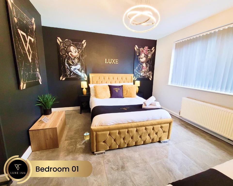 two beds in a room with black walls at Nr Birmingham City Centre, 5 Bed, Luxe Inn in Birmingham