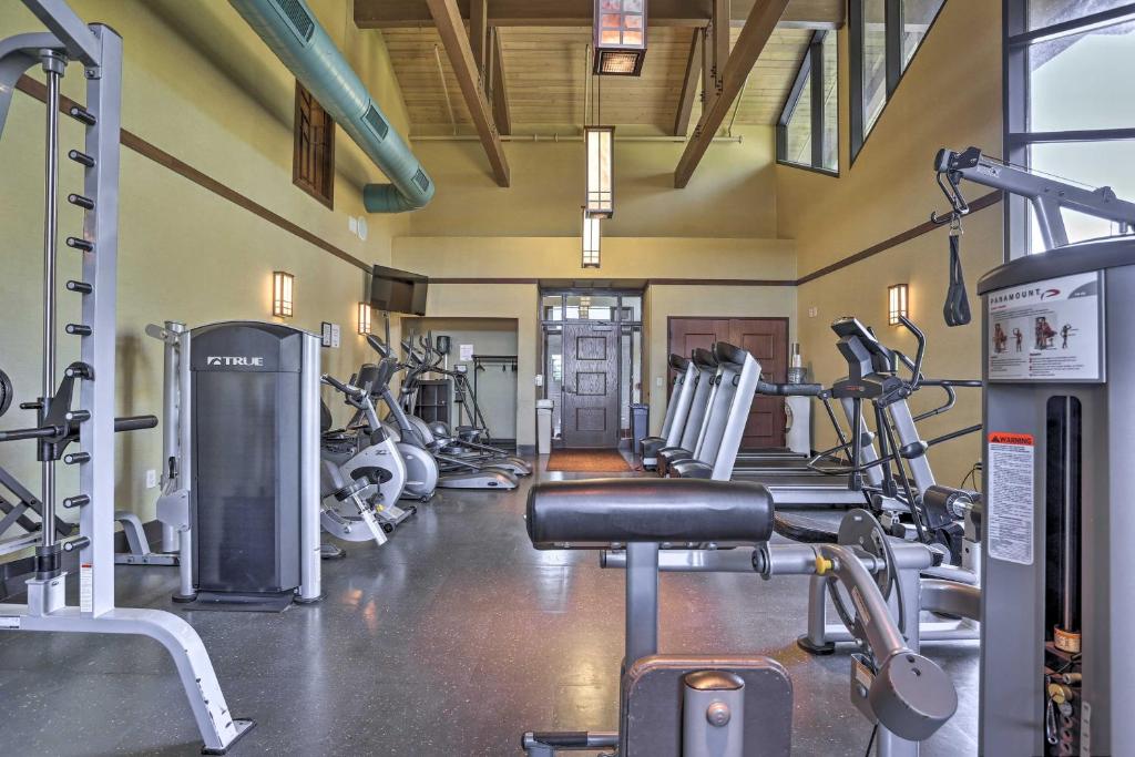 a gym with several treadmills and cardio machines at Hot Tub and Resort Amenities Pocono Lake Retreat! in Pocono Lake