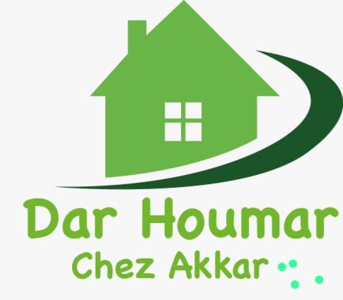 een logo van een huis met de woorden dartham chef Ashker bij Gîte El houmar in Tanakoub