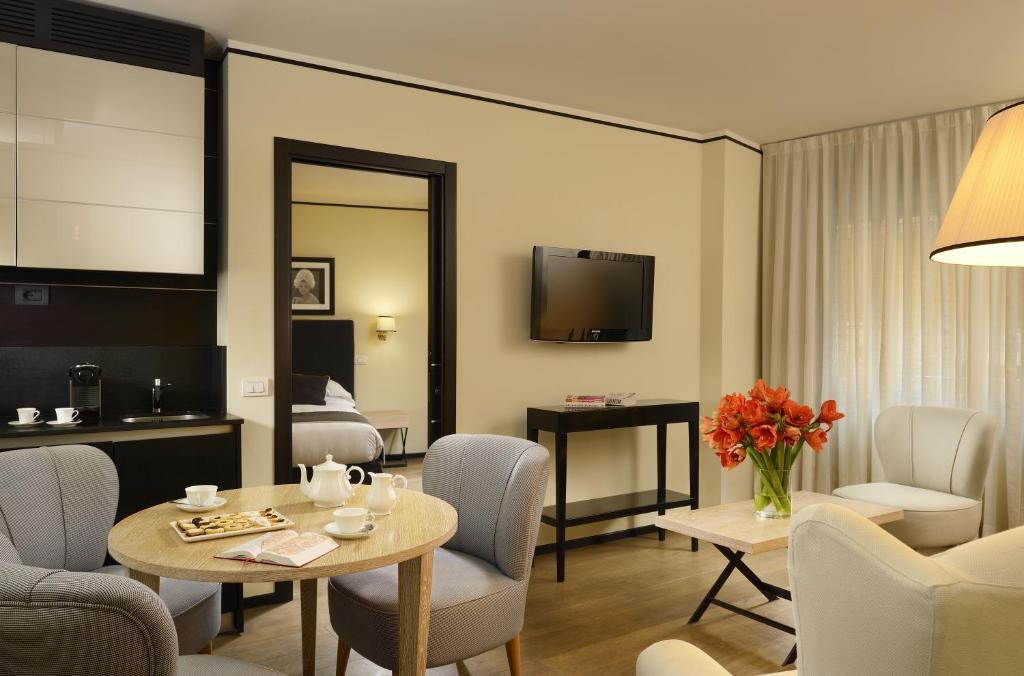 TV a/nebo společenská místnost v ubytování Ponte Vecchio Suites & Spa