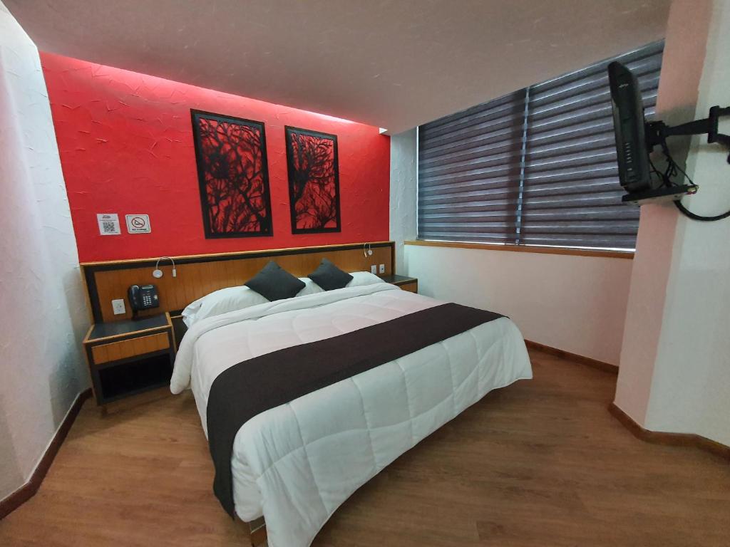 Postel nebo postele na pokoji v ubytování Hotel Alcampo
