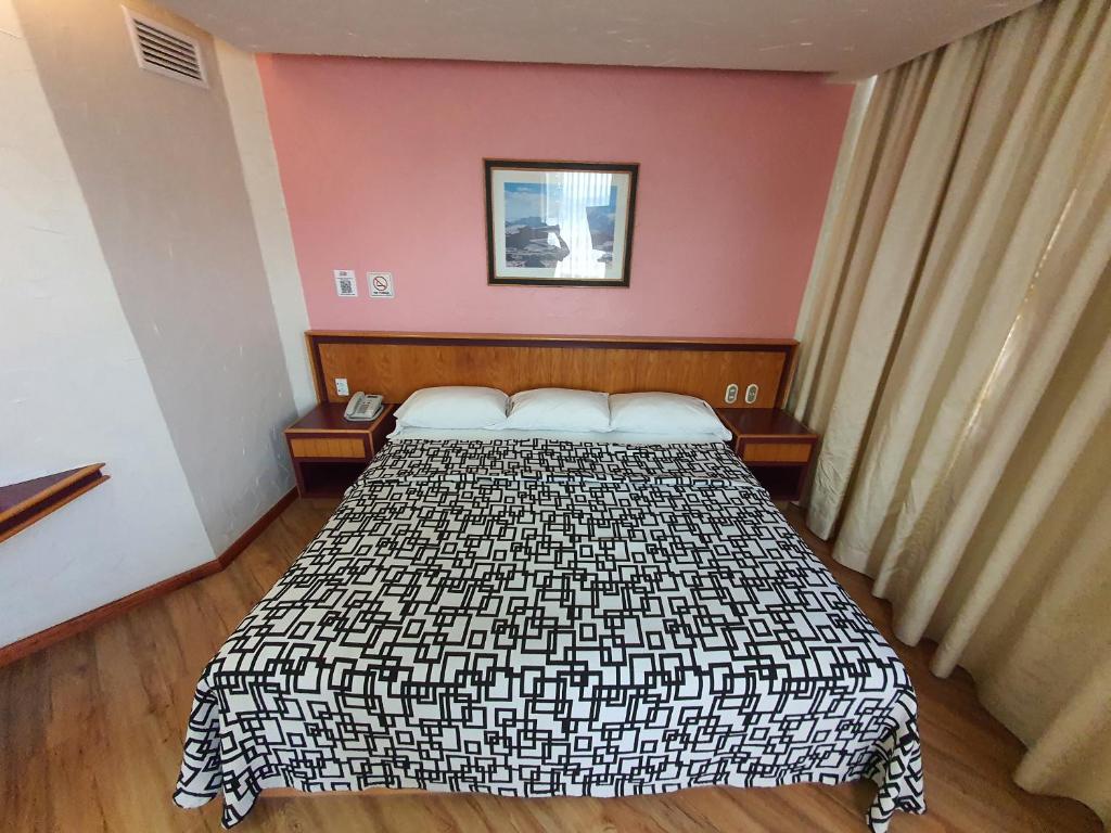 Postel nebo postele na pokoji v ubytování Hotel Alcampo