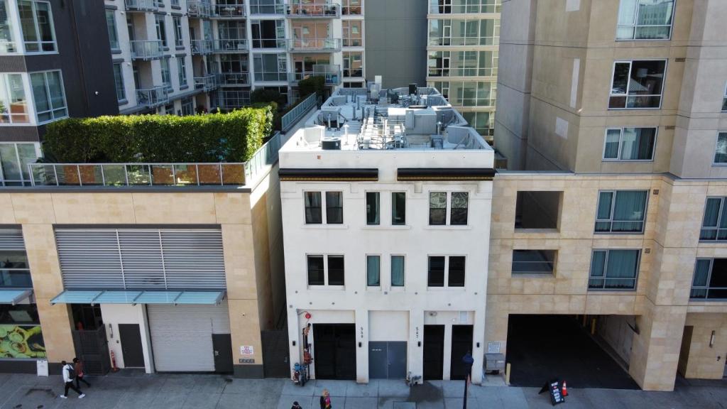 an aerial view of a white building in a city at Hotel Gigi in San Diego