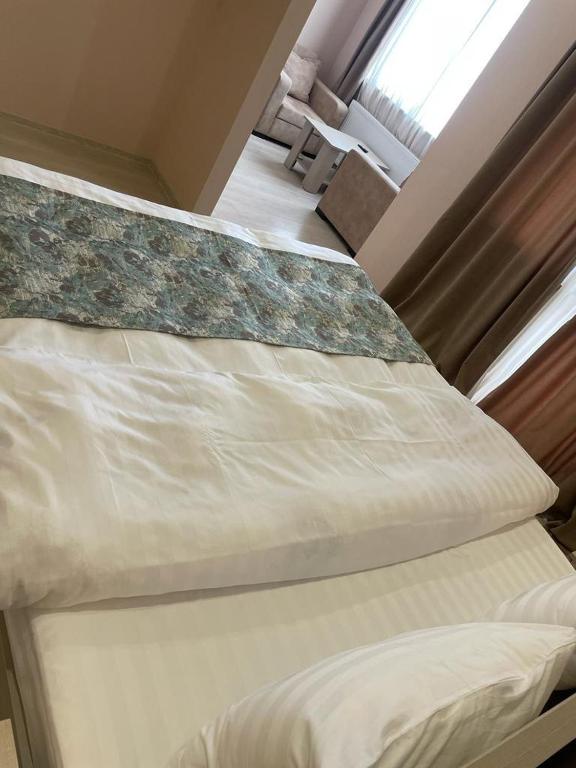 Postel nebo postele na pokoji v ubytování Royal Green Hotel