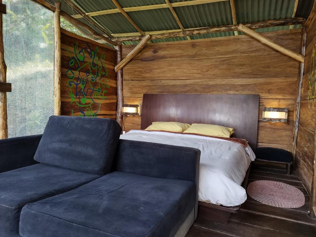 Postel nebo postele na pokoji v ubytování Monte La MaMa Ecolodge