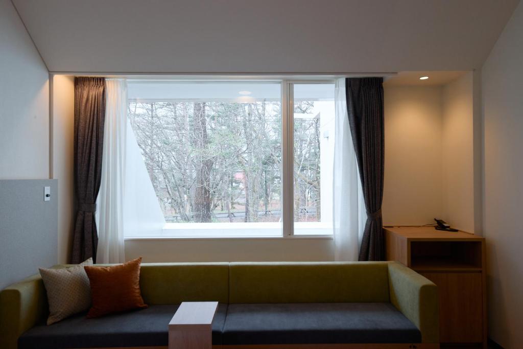 Posezení v ubytování Fourtreat Kusatsu