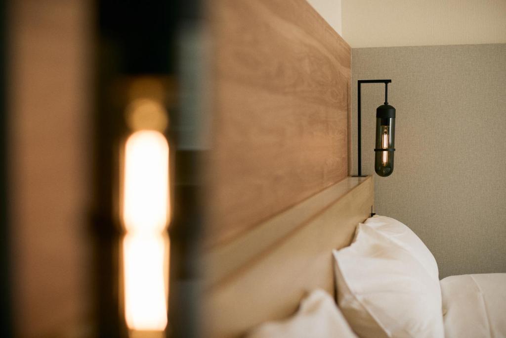 Postel nebo postele na pokoji v ubytování Fourtreat Kusatsu