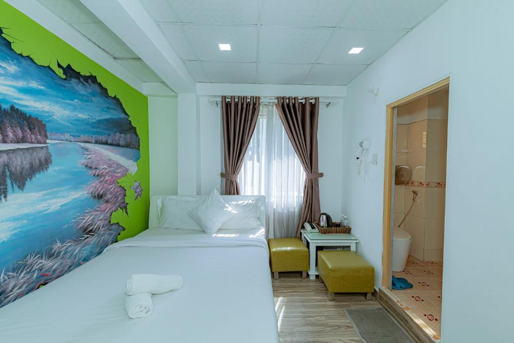 Postel nebo postele na pokoji v ubytování Ken's Backpackers Hotel