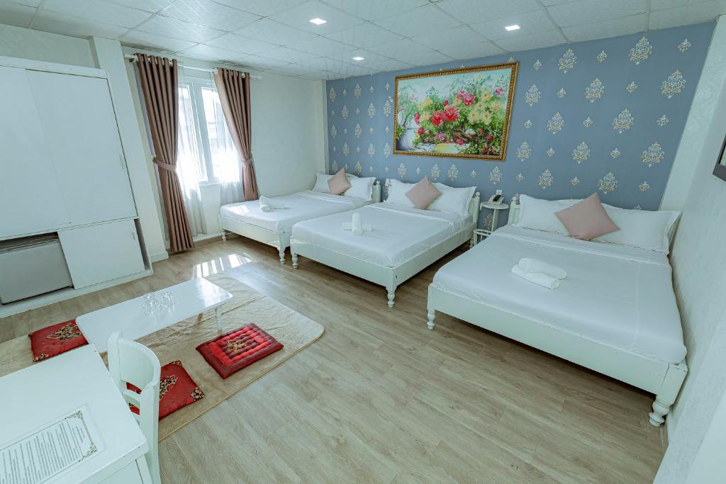 Postel nebo postele na pokoji v ubytování Ken's Backpackers Hotel