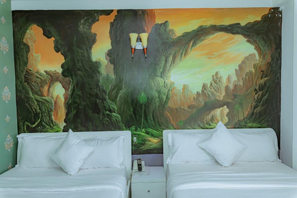 Postel nebo postele na pokoji v ubytování Ken's Backpackers Hotel