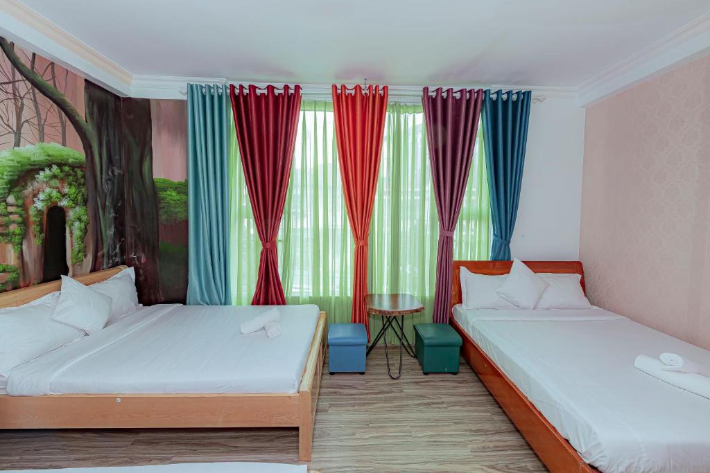 Postel nebo postele na pokoji v ubytování Ken's Backpackers Hotel