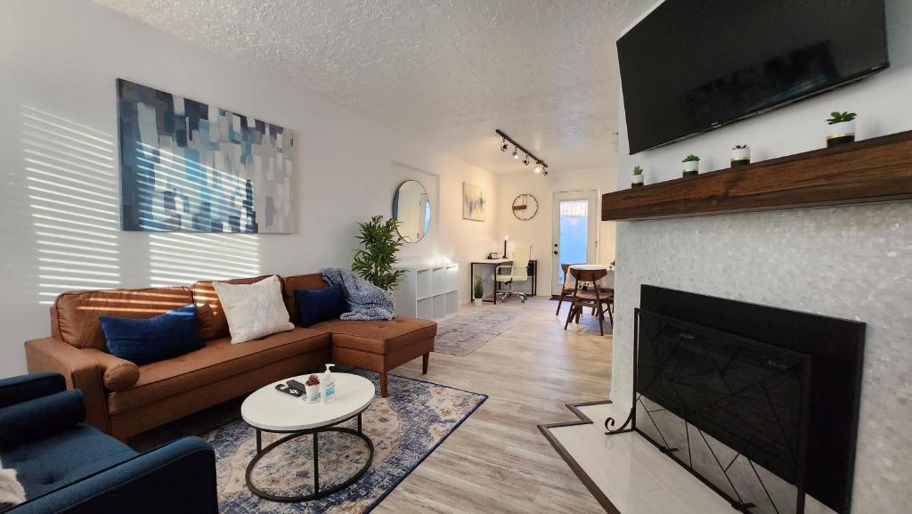 a living room with a couch and a fireplace at The Lilly Pad II in Albuquerque