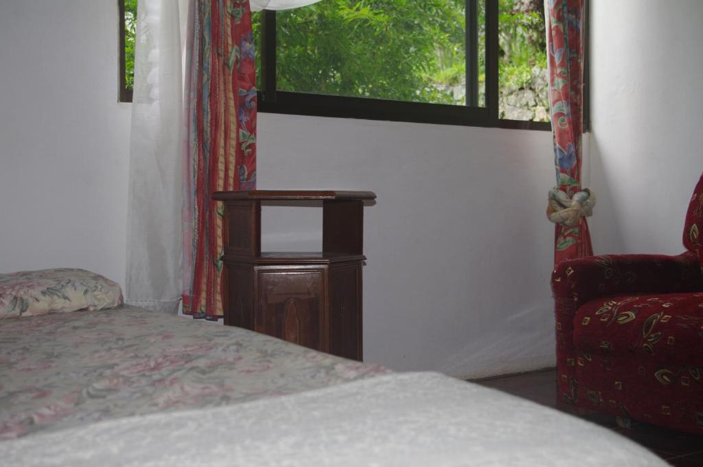 Postel nebo postele na pokoji v ubytování Papaya Guesthouse