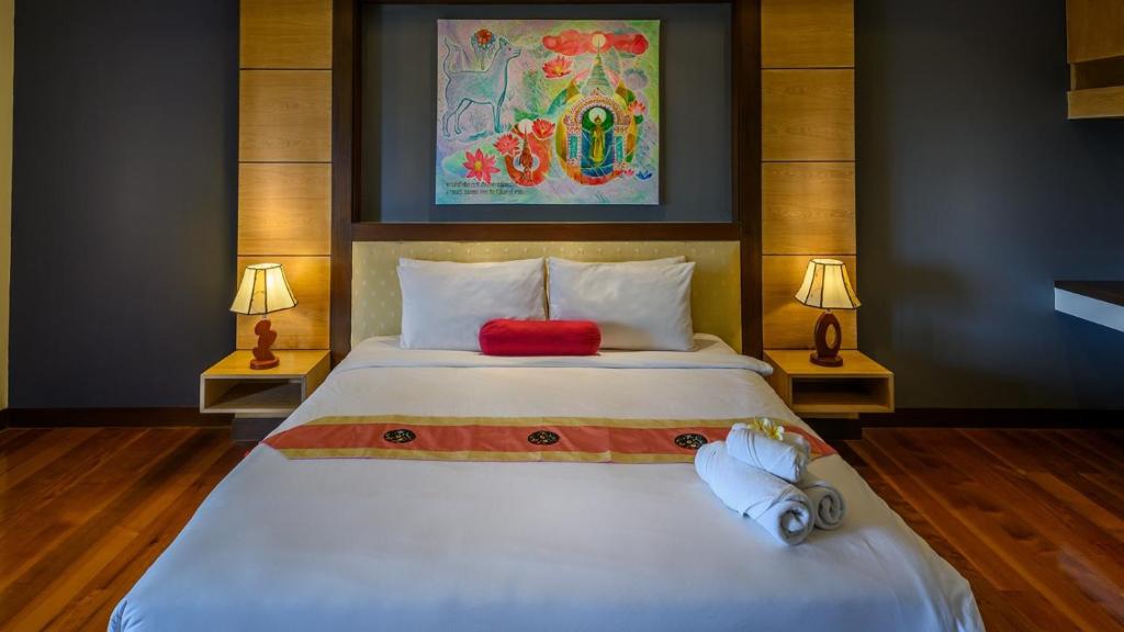 Postel nebo postele na pokoji v ubytování Koh Samui Tower