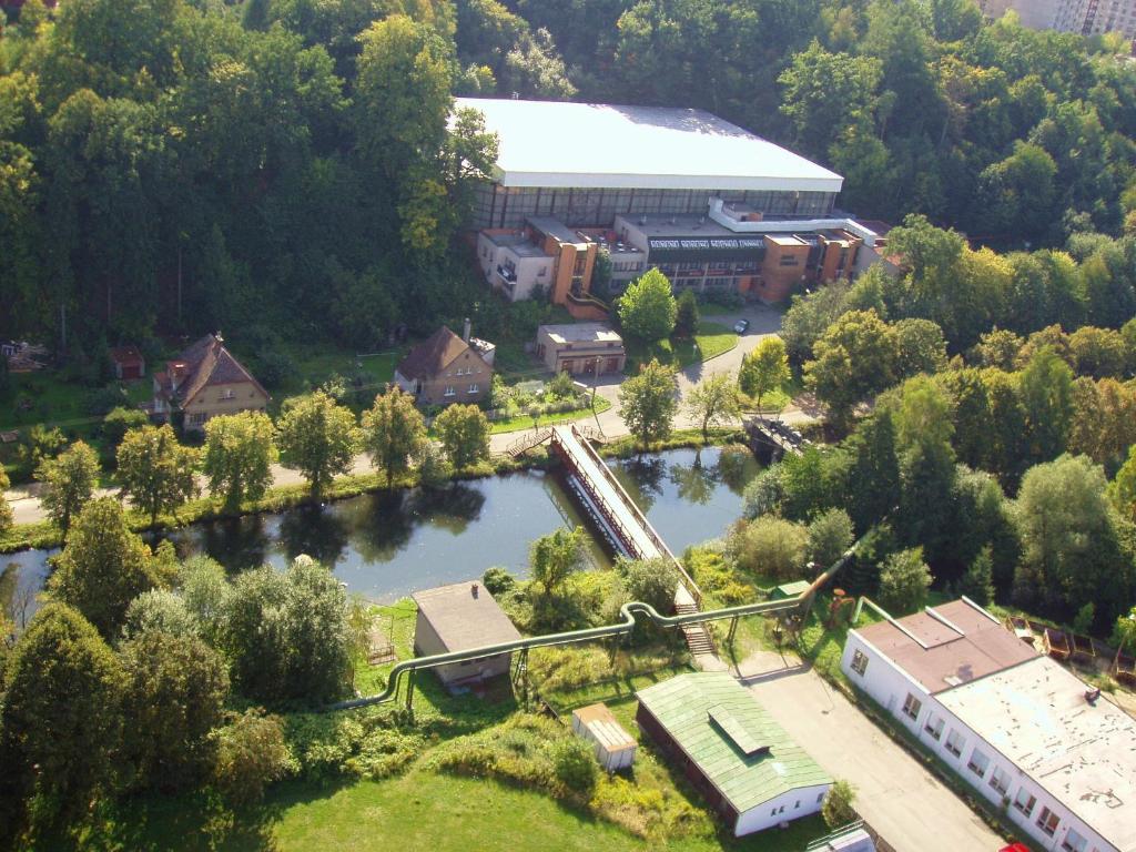 an aerial view of a building next to a river at Hotel Zimní stadion Náchod in Náchod