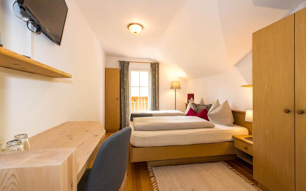 Postel nebo postele na pokoji v ubytování Haus Claudia B&B