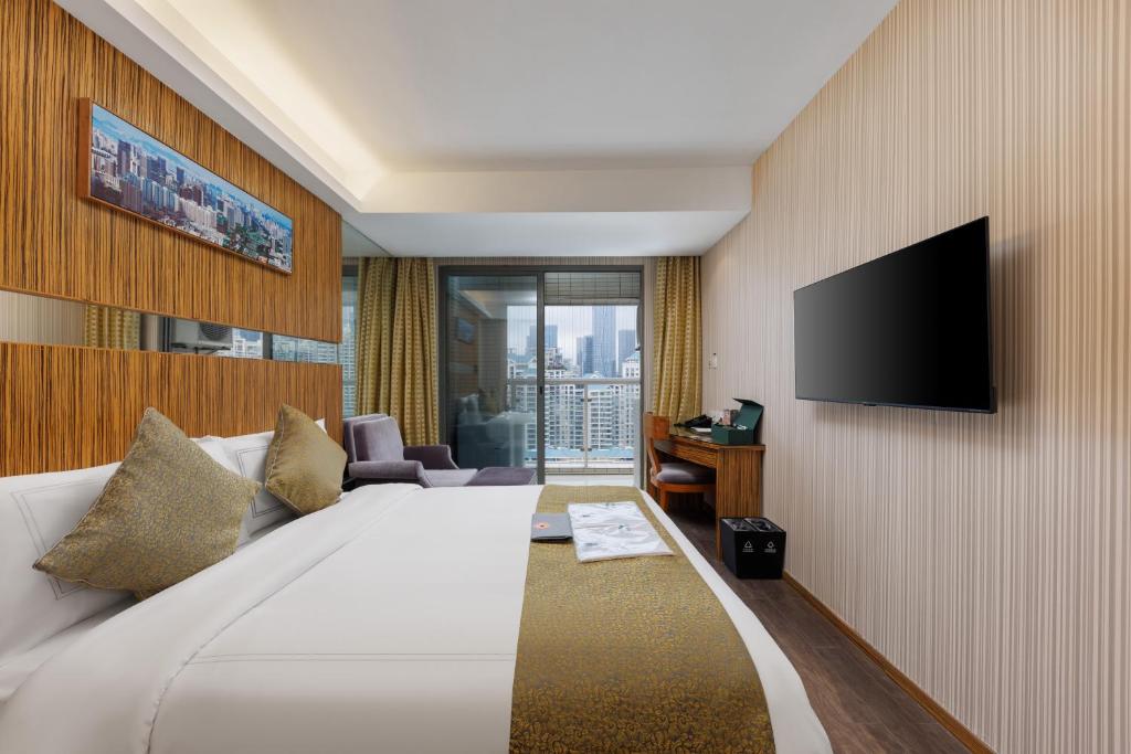TV a/nebo společenská místnost v ubytování Sunflower Hotel &Residence, Futian Port Branch