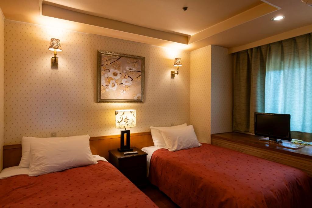 Postel nebo postele na pokoji v ubytování Kinugawa Grand Hotel Yumenotoki