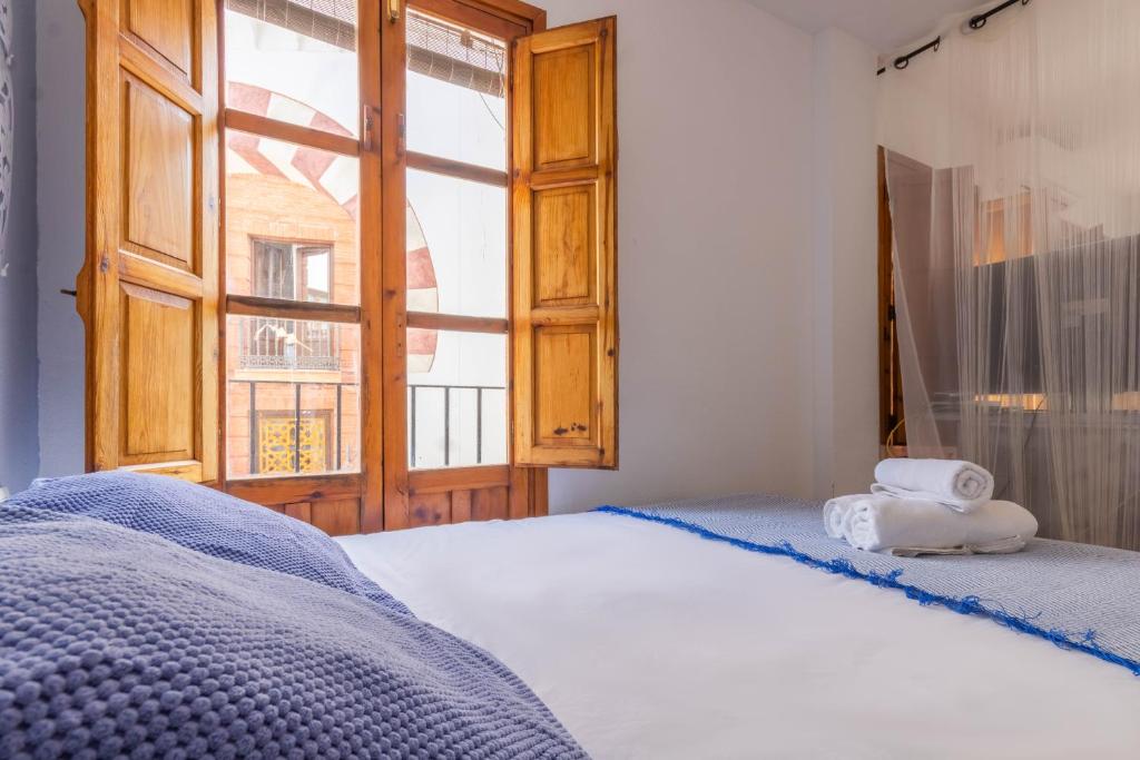 A bed or beds in a room at Apartamento Ilusión Andaluza