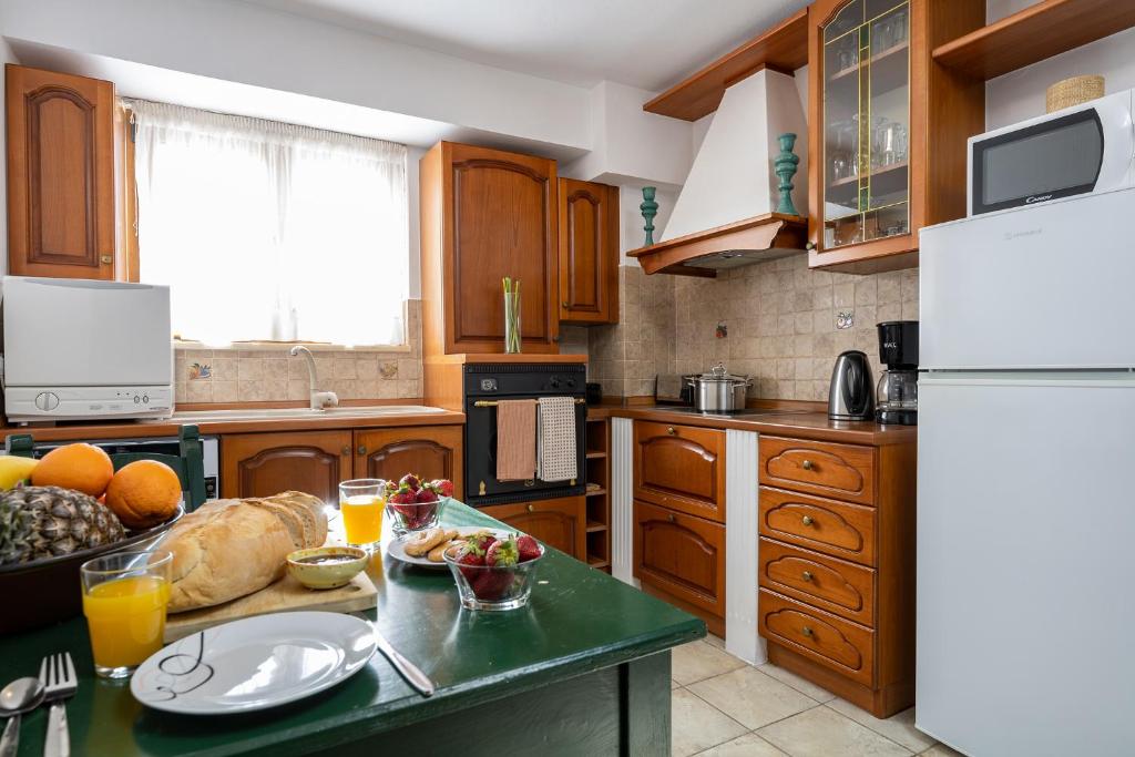 A kitchen or kitchenette at Villa Eleftheria private pool/garden/view/3bdrms/3.5bthrms