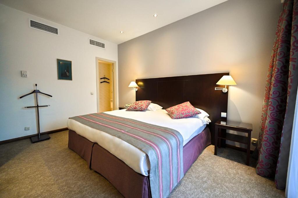 Postel nebo postele na pokoji v ubytování Europe Hotel