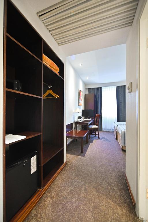 Postel nebo postele na pokoji v ubytování Europe Hotel