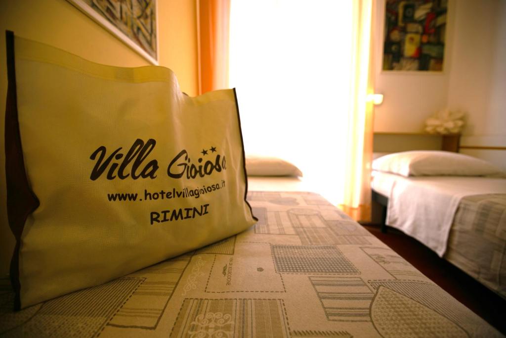 Postel nebo postele na pokoji v ubytování Hotel Villa Gioiosa