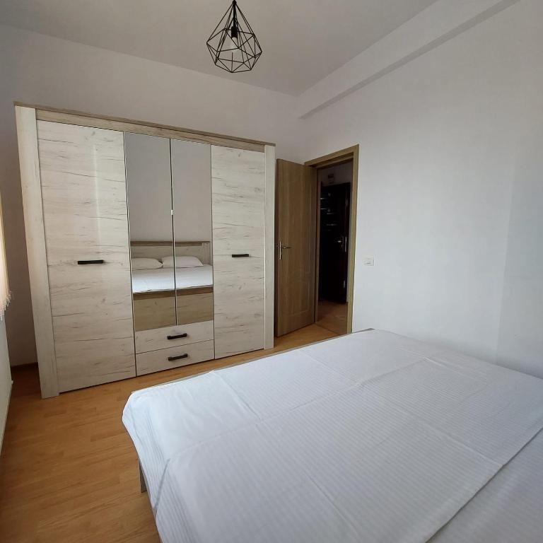 Postel nebo postele na pokoji v ubytování Rio Apartament