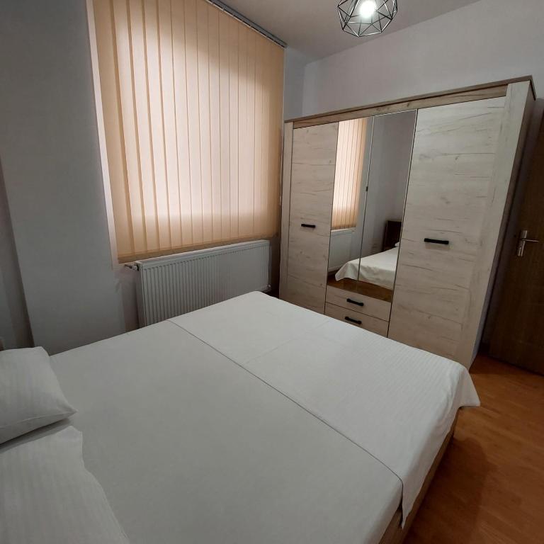 Postel nebo postele na pokoji v ubytování Rio Apartament