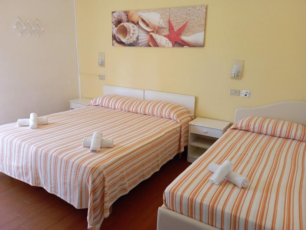 Postel nebo postele na pokoji v ubytování Hotel Villa Gioiosa
