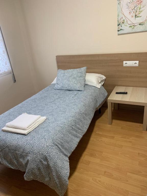 Postel nebo postele na pokoji v ubytování Pension Valcarce