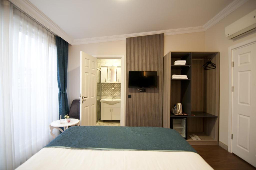 Postel nebo postele na pokoji v ubytování Genius Hotel Istanbul