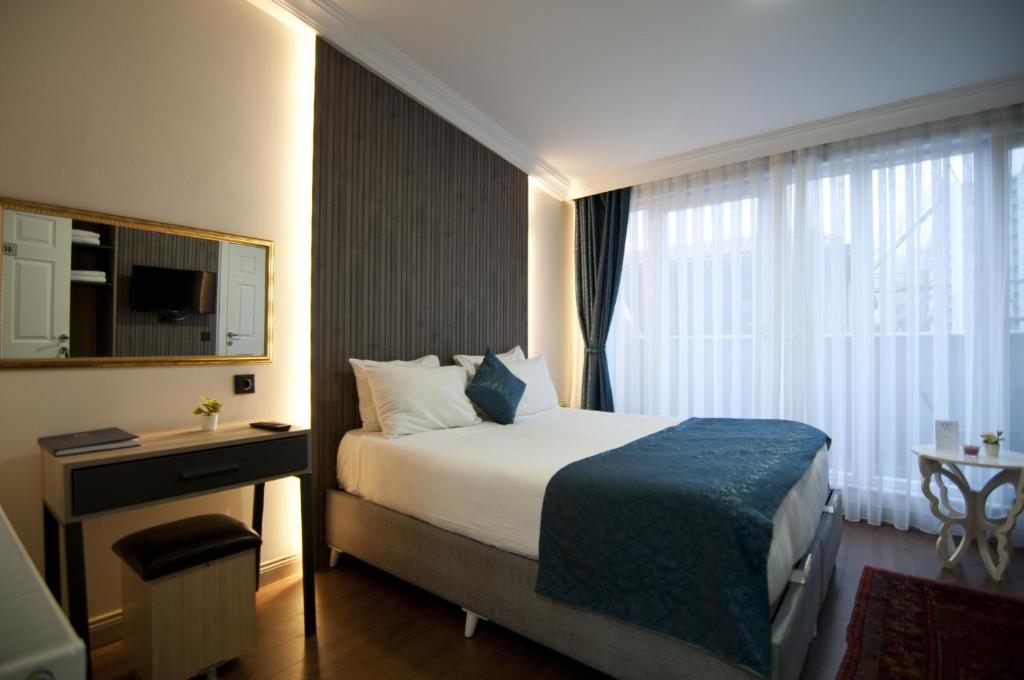 Postel nebo postele na pokoji v ubytování Genius Hotel Istanbul