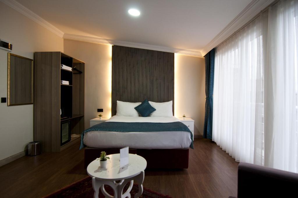 Postel nebo postele na pokoji v ubytování Genius Hotel Istanbul