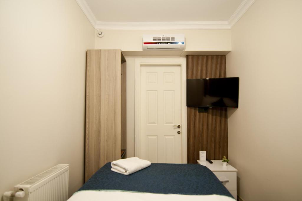 Postel nebo postele na pokoji v ubytování Genius Hotel Istanbul