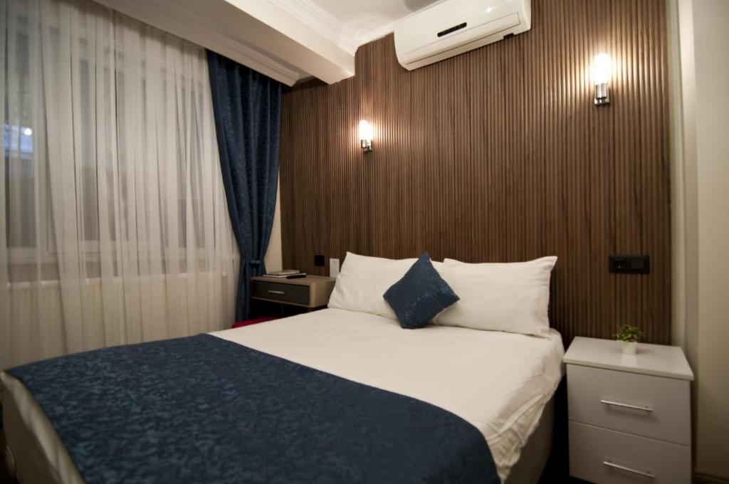 Postel nebo postele na pokoji v ubytování Genius Hotel Istanbul