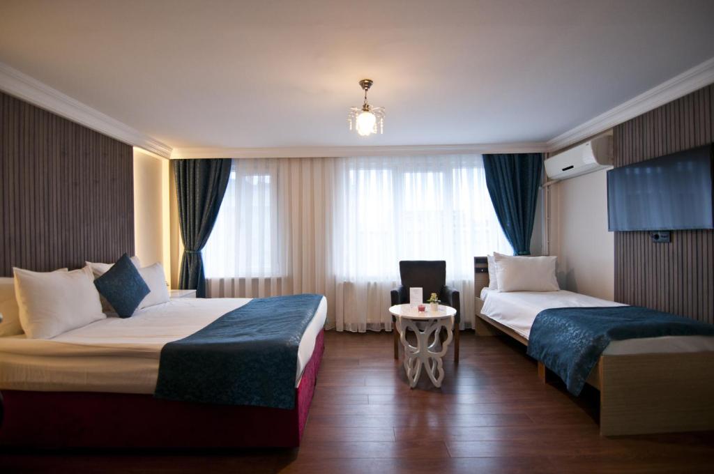 Postel nebo postele na pokoji v ubytování Genius Hotel Istanbul