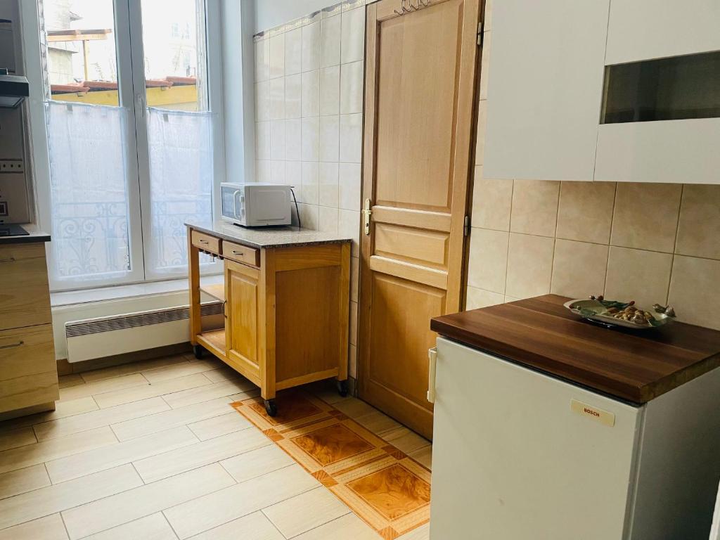 Kuchnia lub aneks kuchenny w obiekcie Les appartements du village