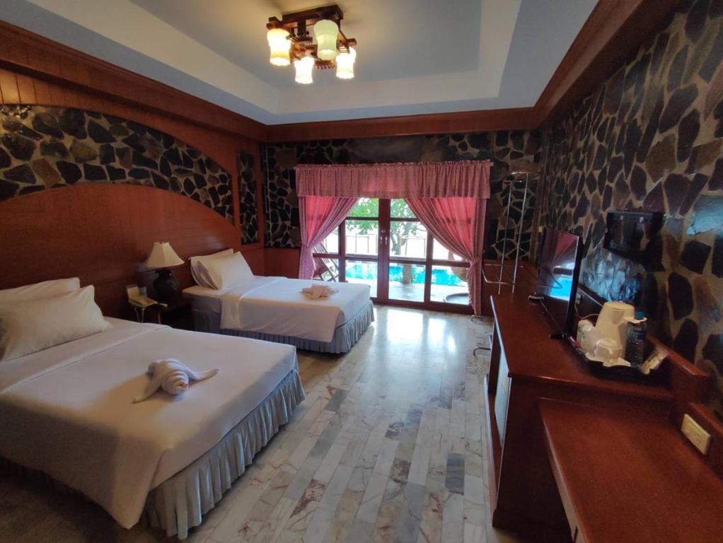 Postel nebo postele na pokoji v ubytování Koh Chang Lagoon Princess