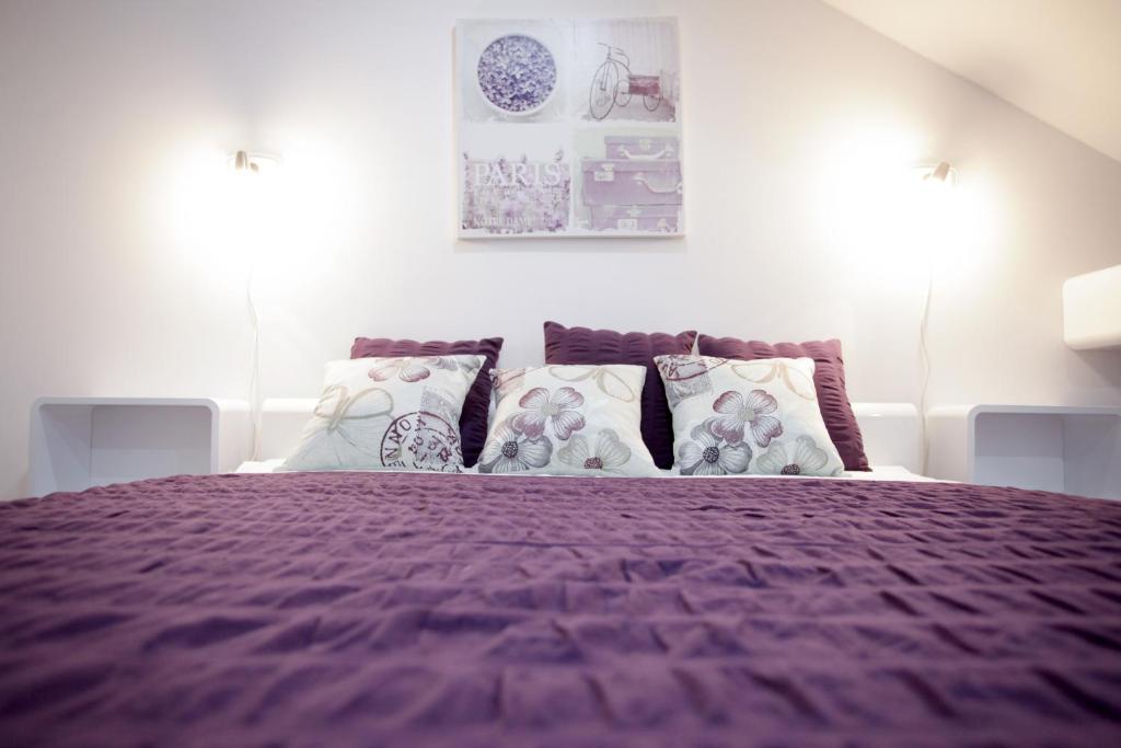 Łóżko lub łóżka w pokoju w obiekcie Bonus Apartments