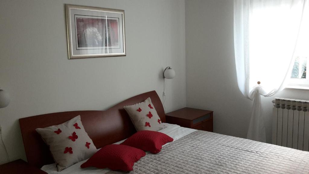 Łóżko lub łóżka w pokoju w obiekcie Bonus Apartments