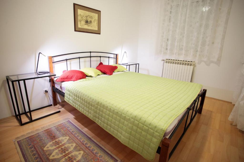 Łóżko lub łóżka w pokoju w obiekcie Bonus Apartments