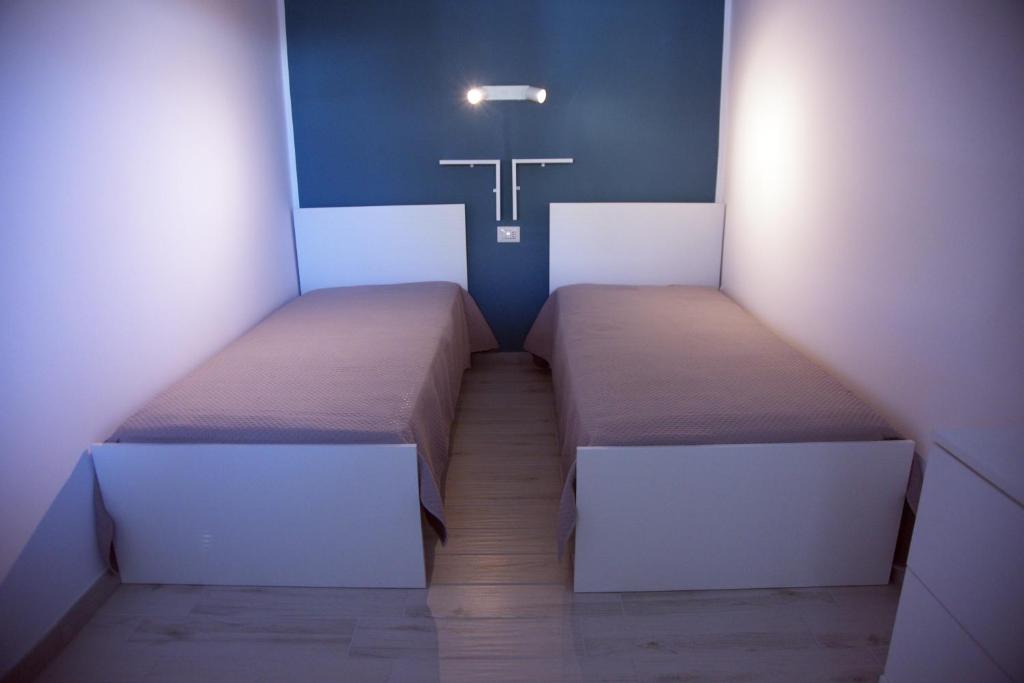 Posteľ alebo postele v izbe v ubytovaní Amare Home