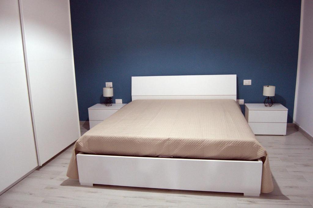 Posteľ alebo postele v izbe v ubytovaní Amare Home