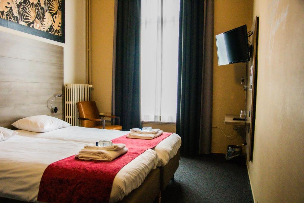 Postel nebo postele na pokoji v ubytování Hotel Industrie
