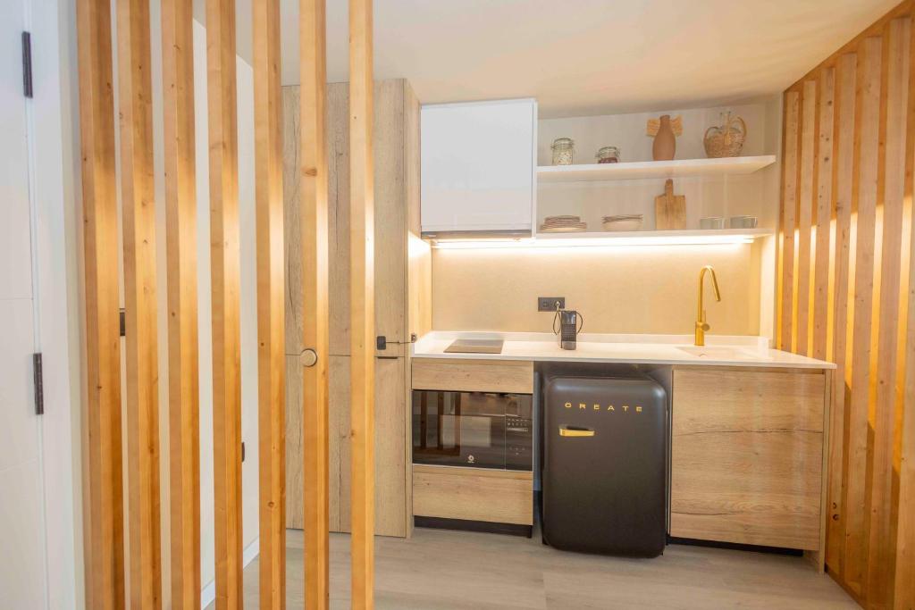 A kitchen or kitchenette at Jávea Boutique Suites - Holiday Apartments
