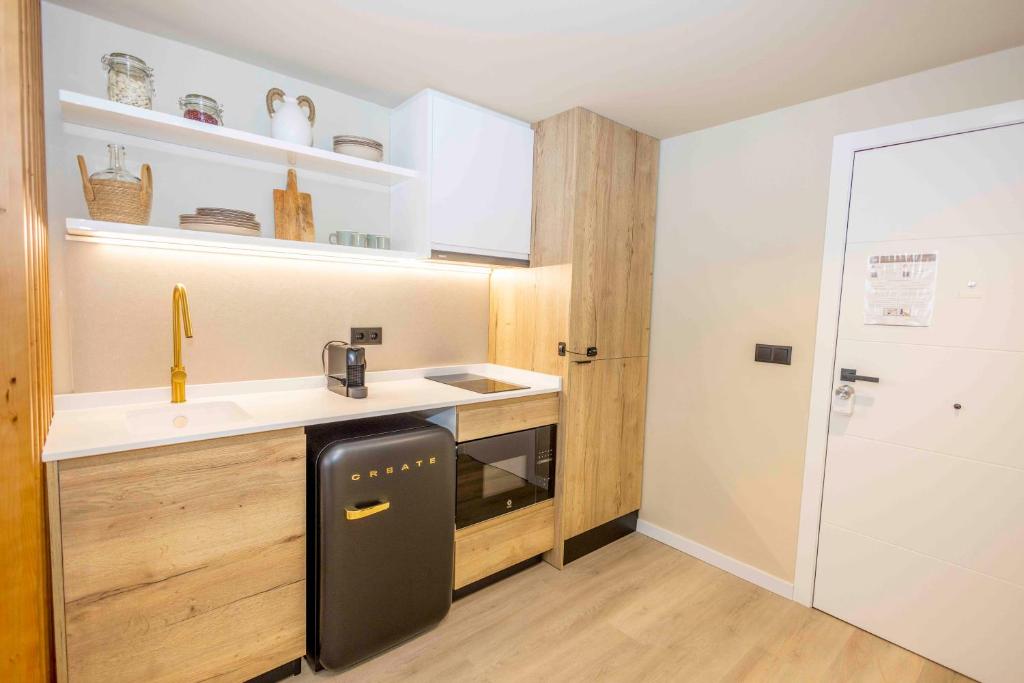 A kitchen or kitchenette at Jávea Boutique Suites - Holiday Apartments