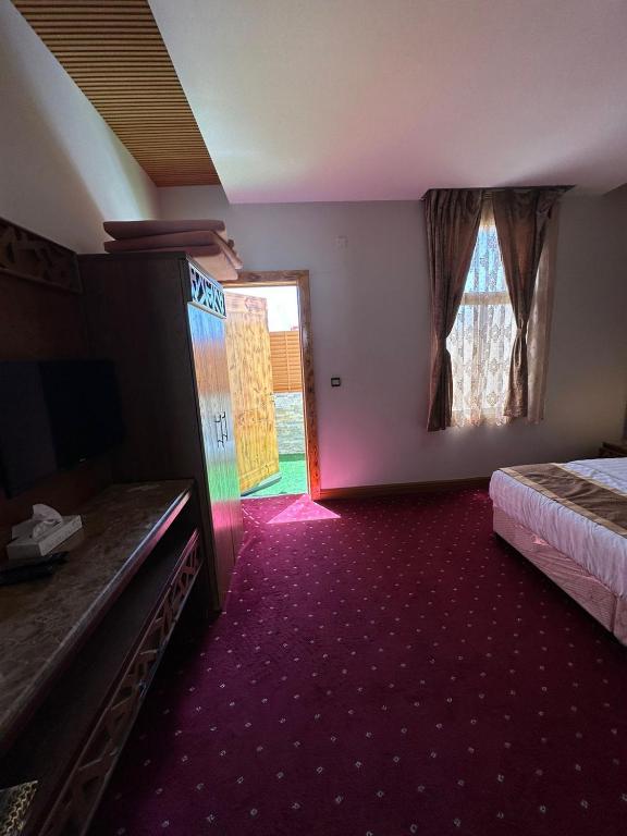 Postel nebo postele na pokoji v ubytování Leen Serviced Apartments-لين للشقق المخدومه