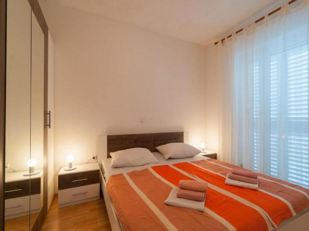 Postel nebo postele na pokoji v ubytování Apartment Stipic Omis
