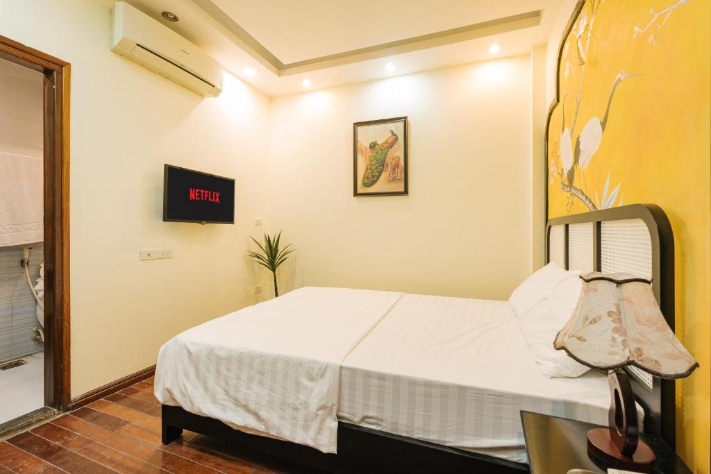 Postel nebo postele na pokoji v ubytování Sun Clover Boutique Hotel